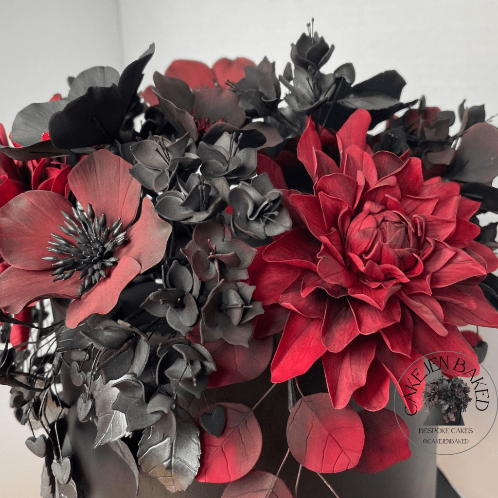 red sugar dahlia and black  and burgundy hellebore