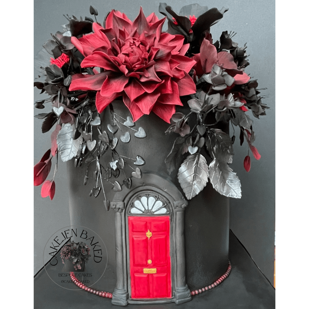 Cake designed to the theme Paint It, Black. Stunning handmade sugar dahlias, hellebores, hearts, smoke bush and rose leaves