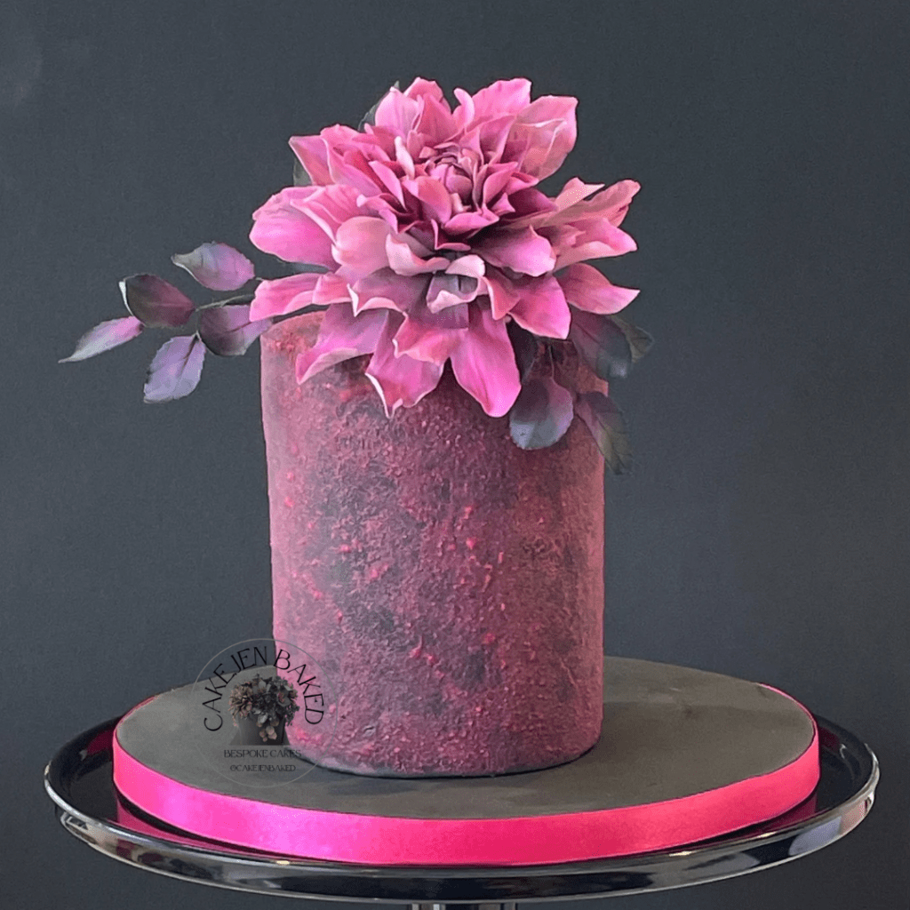 mini 4 inch birthday cake decorated with textured sugar paste. Stunning handmade pink dahlia 