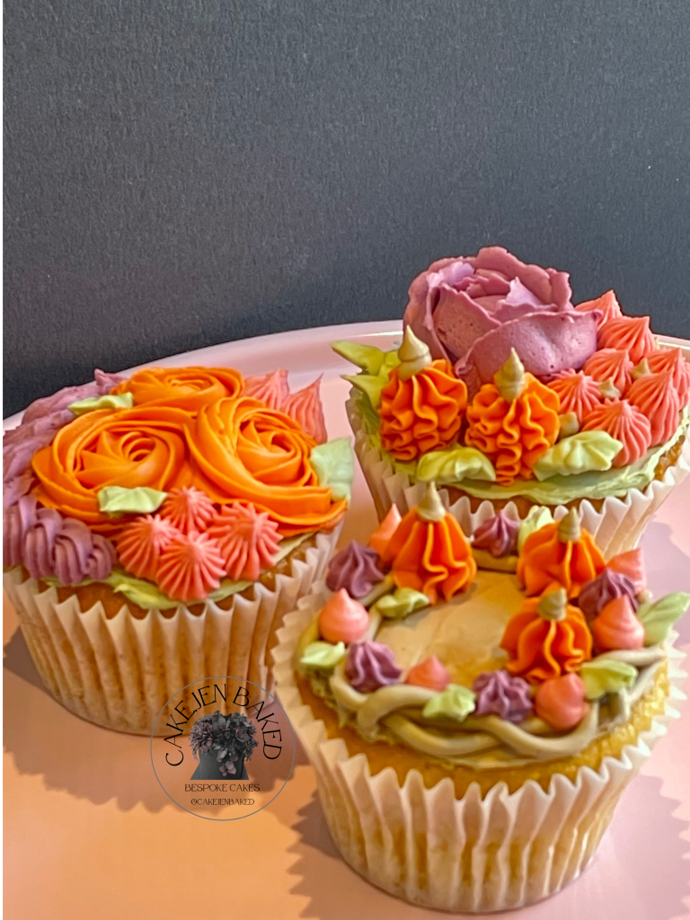 Autumnal or Halloween cupcakes. Wreath with mini buttercream pumpkins, buttercream rose with mini pumpkins