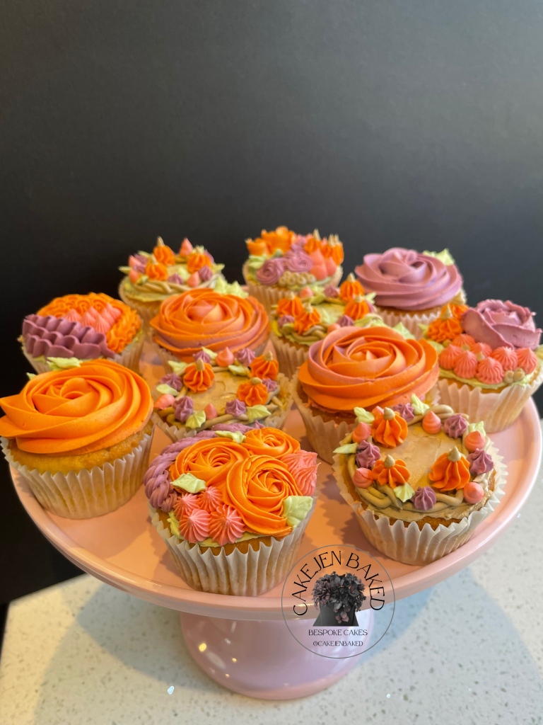 Autumnal or Halloween cupcakes. Wreath with mini buttercream pumpkins, buttercream rose with mini pumpkins