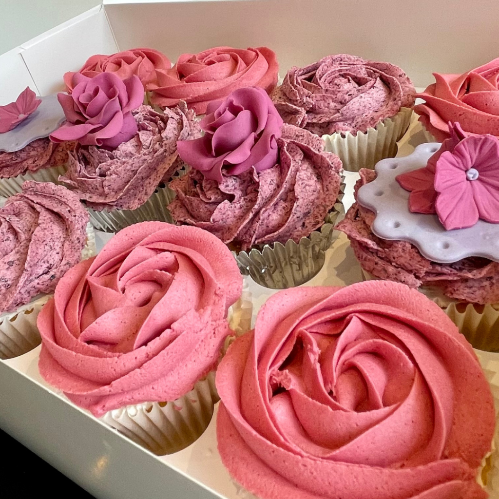 Floral cupcakes with handmade sugar roses and floral toppers
