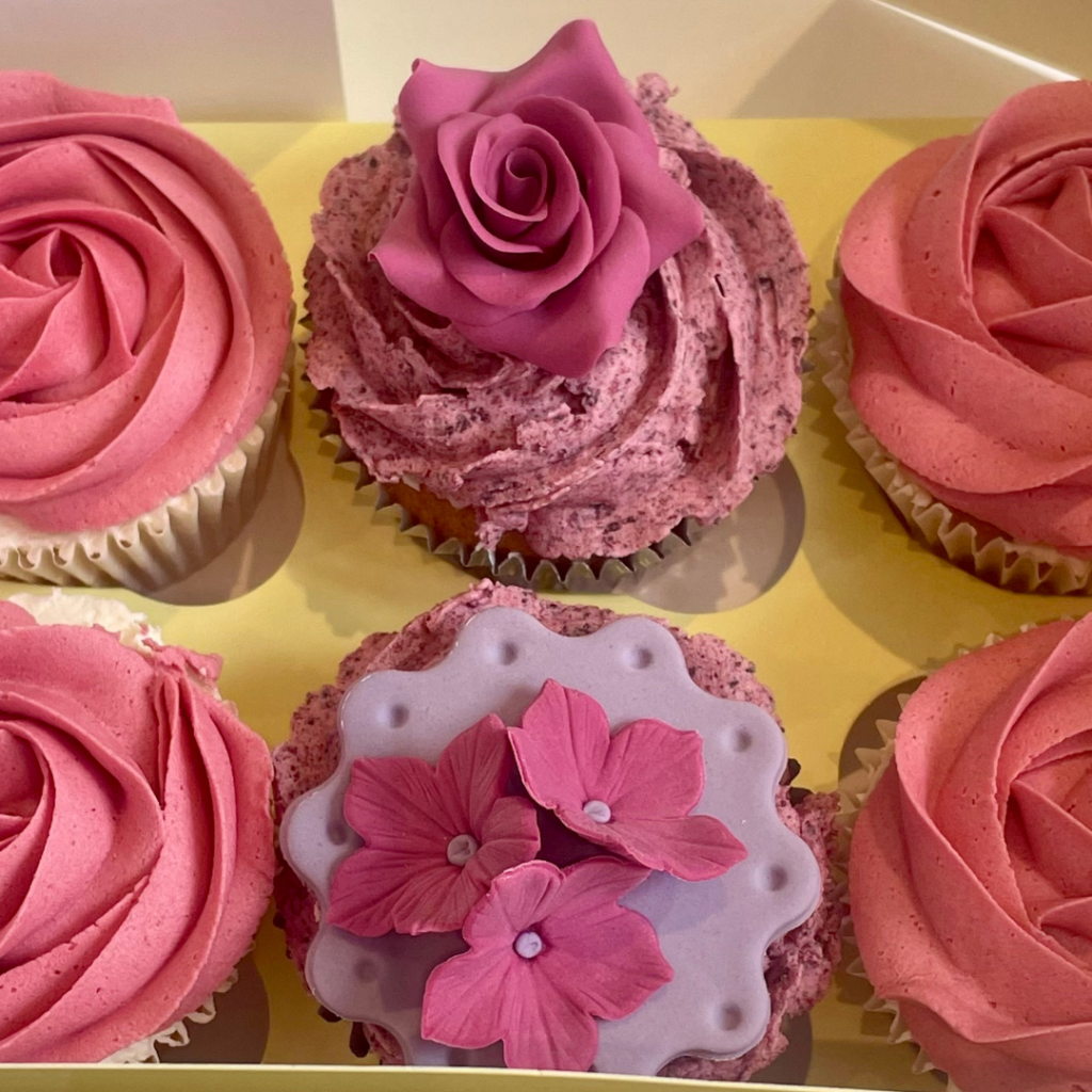 Floral cupcakes with handmade sugar roses and floral toppers