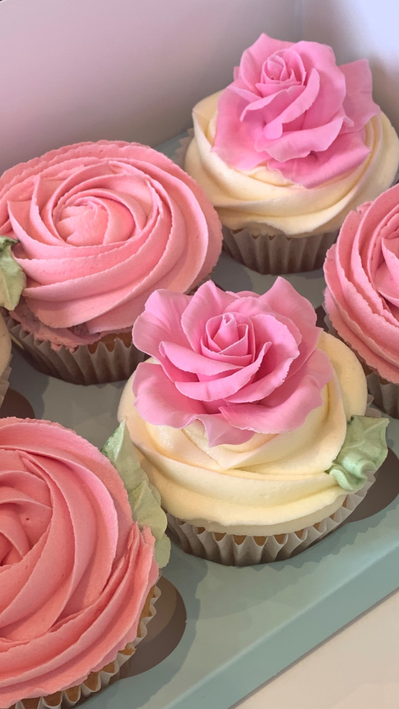 pink cupcakes with rose swirl and sugar roses